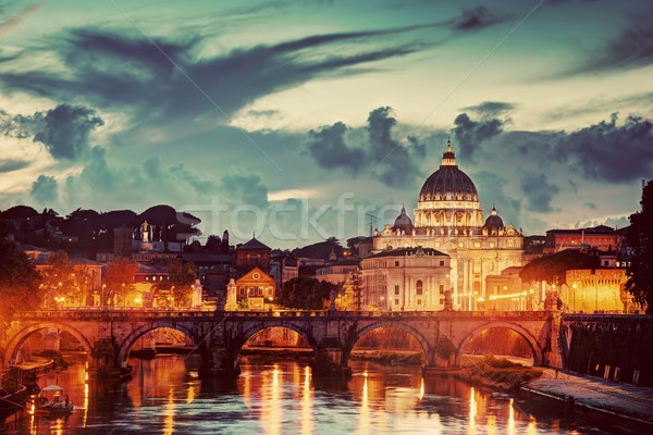 St. Peter's Basilica, Vatican City.  Tiber river in Rome, Italy at late sunset, evening. Stock photo © photocreo