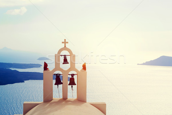 Traditional bells and cross over Aegean sea. Santorini Greece Stock photo © photocreo