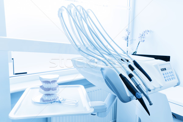 Stock photo: Equipment and dental instruments in dentist's office. Clean teeth