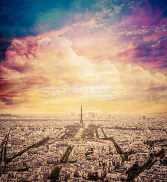 Paris, France skyline with fantastic unique sunset sky. Eiffel Tower in warm light Stock photo © photocreo