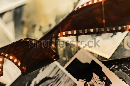 Old film strip and photos background Stock photo © photocreo