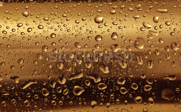 Gold plate with water drops on the rounded surface. Stock photo © photocreo
