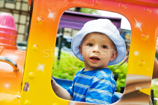 Happy child in funfair Stock photo © photocreo