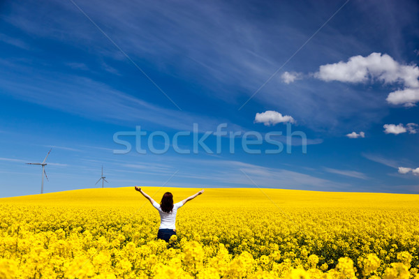 Happy young woman on spring field. Success, harmony, health, ecology Stock photo © photocreo