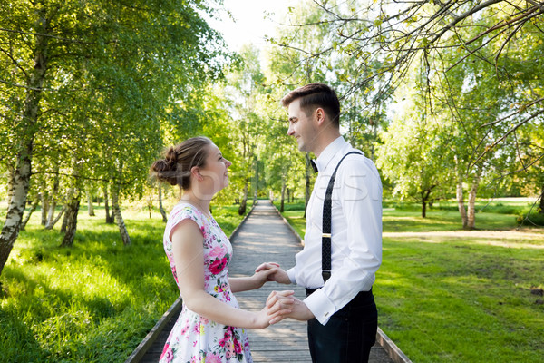 Young couple in love together, holding hands. Stock photo © photocreo