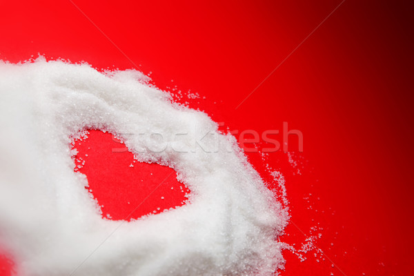 Sweet heart of sugar on red background.  Stock photo © photocreo