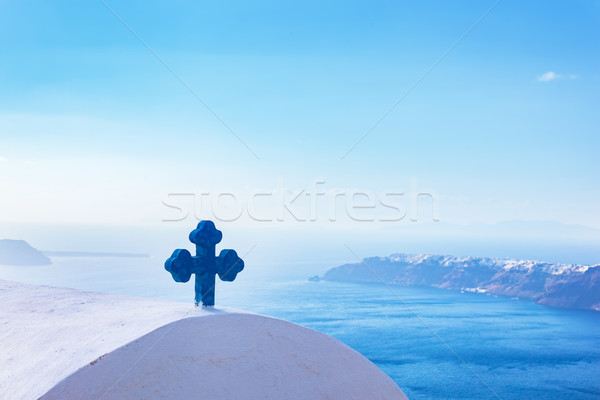 Blue cross on the church roof in Fira on Santorini island, Greece. Aegean sea. view Stock photo © photocreo