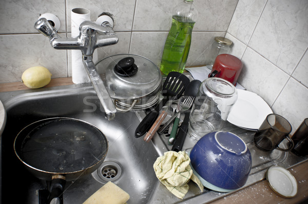 Pile of dirty dishes in the metal sink Stock photo © photocreo