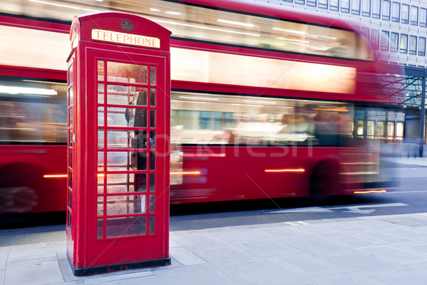 London, UK. Red telephone booth and red bus passing. Symbols of England. Stock photo © photocreo