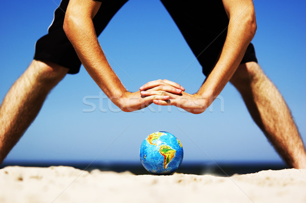 Earth globe with hands over it. Conceptual image Stock photo © photocreo