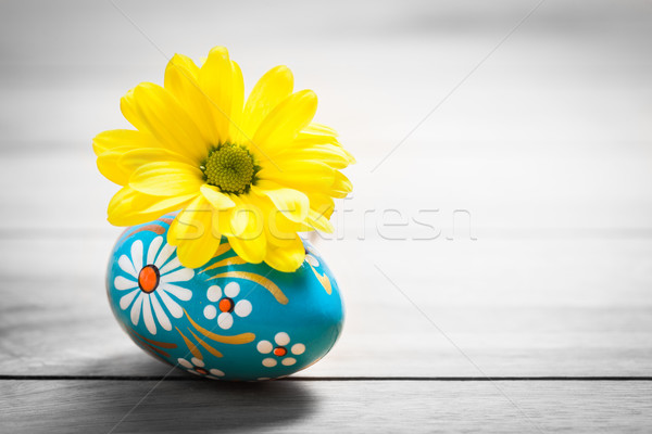 Hand painted Easter egg and spring daisy flower on wood. Stock photo © photocreo