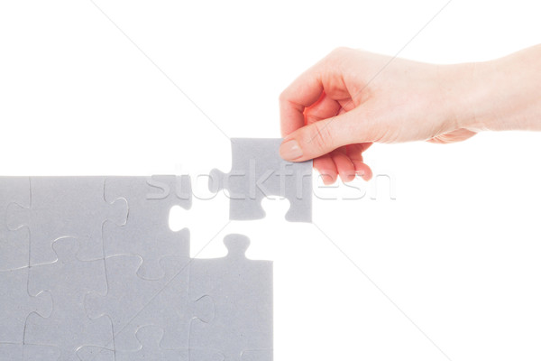 Completing the last piece of jigsaw puzzle. Solution, solving the problem. Stock photo © photocreo