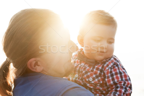 Young father holding his child on the beach portrait Stock photo © photocreo
