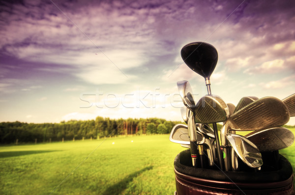 Golf gear, clubs at sunset Stock photo © photocreo