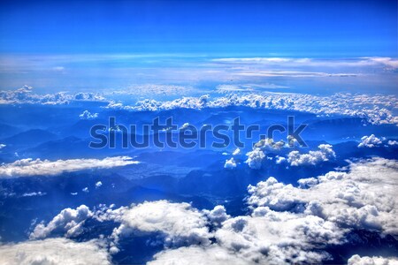 High in the sky, puffy white clouds Stock photo © photocreo