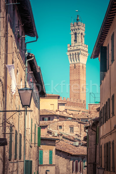 Siena, Italy. Mangia Tower, Italian Torre del Mangia. Tuscany region. Vintage Stock photo © photocreo