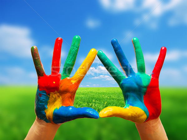 Stock photo: Painted colorful hands showing way to clear happy life