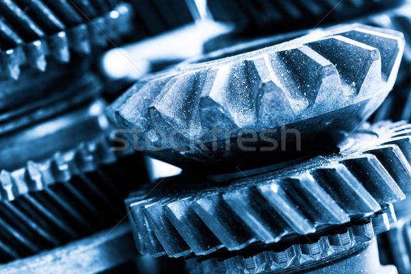 Gears, grunge cogwheels, real engine elements close-up. Heavy industry Stock photo © photocreo