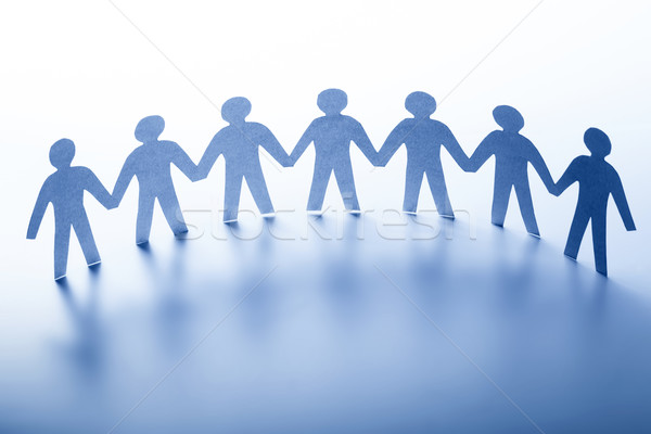 Paper people standing together hand in hand. Team, society, business concept Stock photo © photocreo