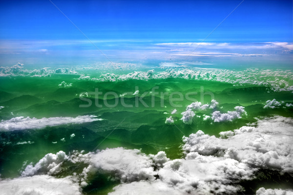 High in the sky, puffy white clouds Stock photo © photocreo