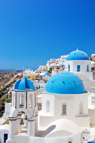 Oia town on Santorini island, Greece. Caldera on Aegean sea. Stock photo © photocreo