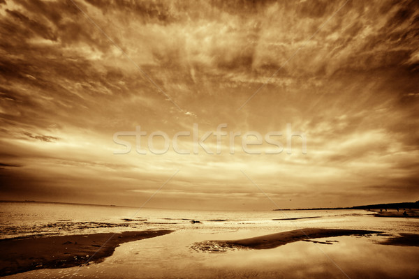 Fine art picture of sea, ocean at sunset. Dramatic sky. Stock photo © photocreo