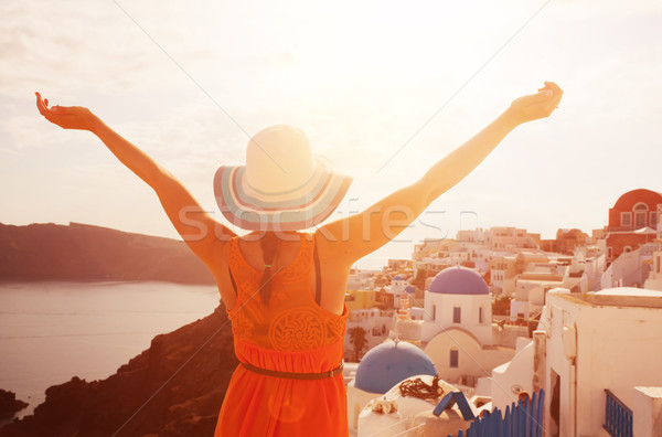 Happy woman enjoying her holidays on Santorini, Greece Stock photo © photocreo