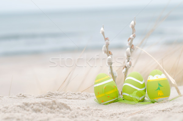 Easter decorated eggs on sand Stock photo © photocreo