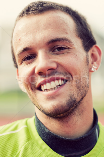 Portrait of a young active man smiling during sport training, exercise Stock photo © photocreo