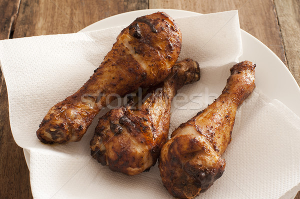 Three marinated spicy chicken drum sticks Stock photo © photohome