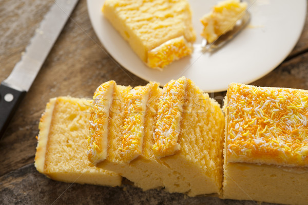 Sliced iced vanilla sponge cake Stock photo © photohome