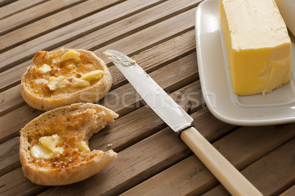 Stick of butter on a tray beside english muffins Stock photo © photohome