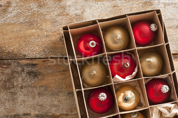 Shiny red and gold holiday ornaments in box Stock photo © photohome
