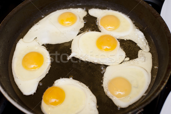Stock photo: Six fried eggs in a pan with oil, for breakfast