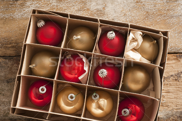 Cardboard carton of red and gold Christmas balls Stock photo © photohome