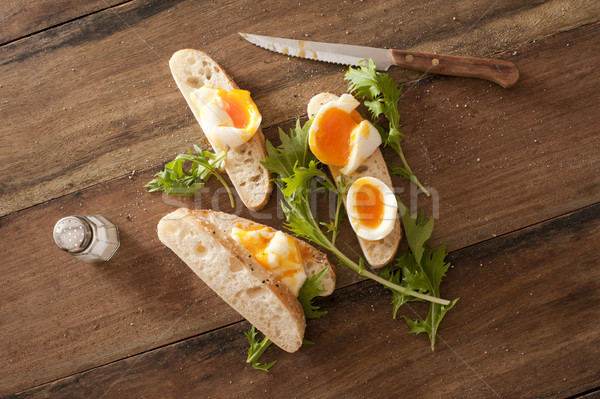 Soft cooked eggs sliced and served on bread Stock photo © photohome