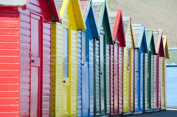 Row of colorful wooden beach huts Stock photo © photohome