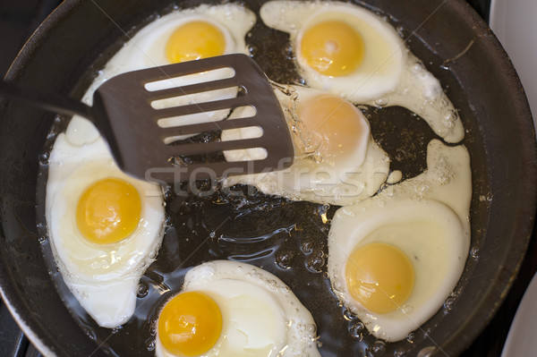 Cooking fried eggs Stock photo © photohome