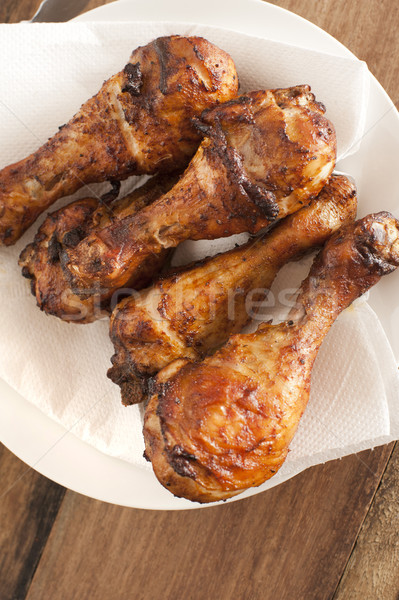Close up on four roasted drumsticks Stock photo © photohome