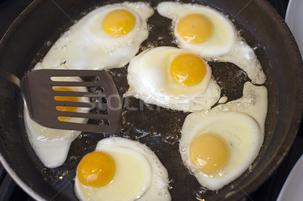 Frying a batch of eggs Stock photo © photohome