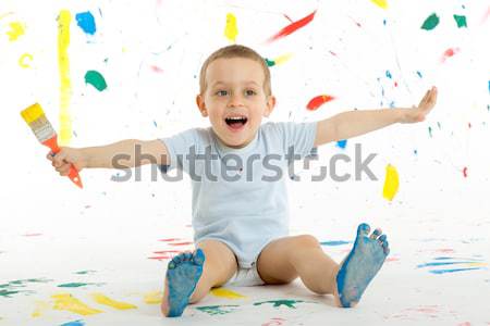 Adorable 3 year old boy child creatively stains on the wall. Stock photo © Photoline