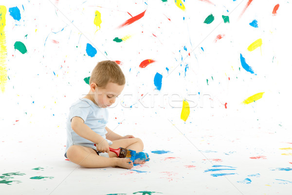 Adorable 3 year old boy child creatively stains on the wall. Stock photo © Photoline