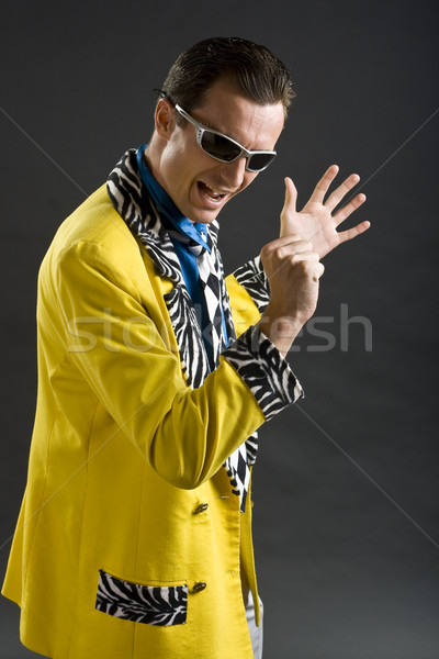 Stock photo: rockabilly singer from 1950s in yellow jacket