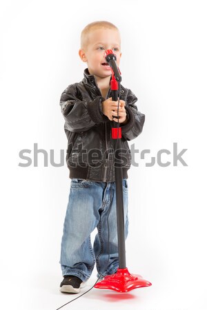 little singer boy singing through a microphone  Stock photo © Photoline