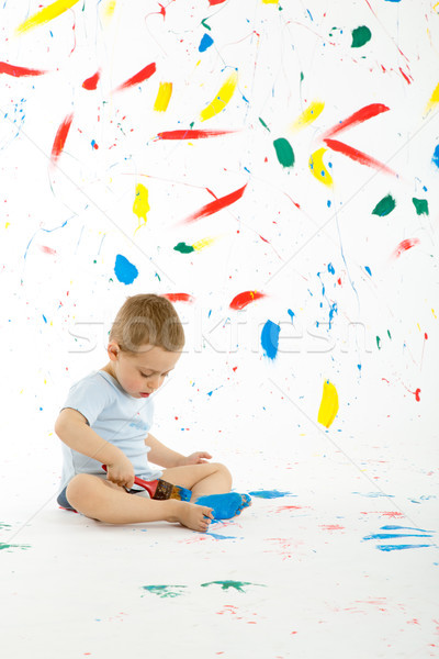 Adorable 3 year old boy child creatively stains on the wall. Stock photo © Photoline