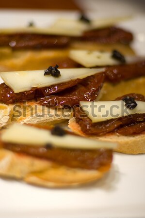 Typical Pintxo (Dry Tomato with truffle) from Spain Stock photo © Photooiasson