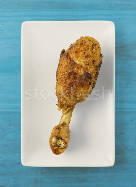 Fried chicken leg. Stock photo © Photooiasson