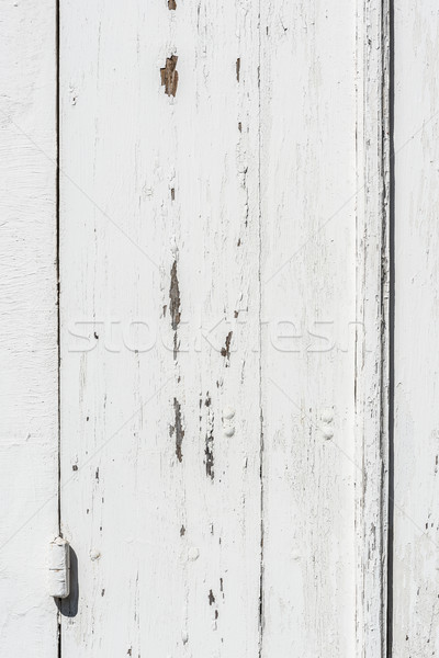 Weathered white wooden door with paint chipped and peeling. Stock photo © Photooiasson