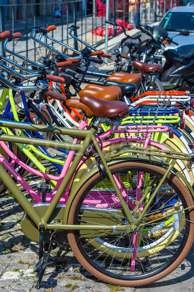 Colored bicycles parked in a european street. Stock photo © Photooiasson