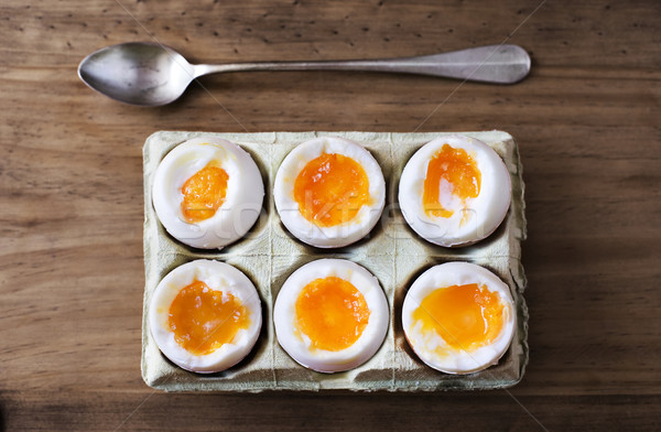 Half a dozen soft boiled eggs. Stock photo © Photooiasson